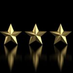 five metal stars showing a reflection on a black background